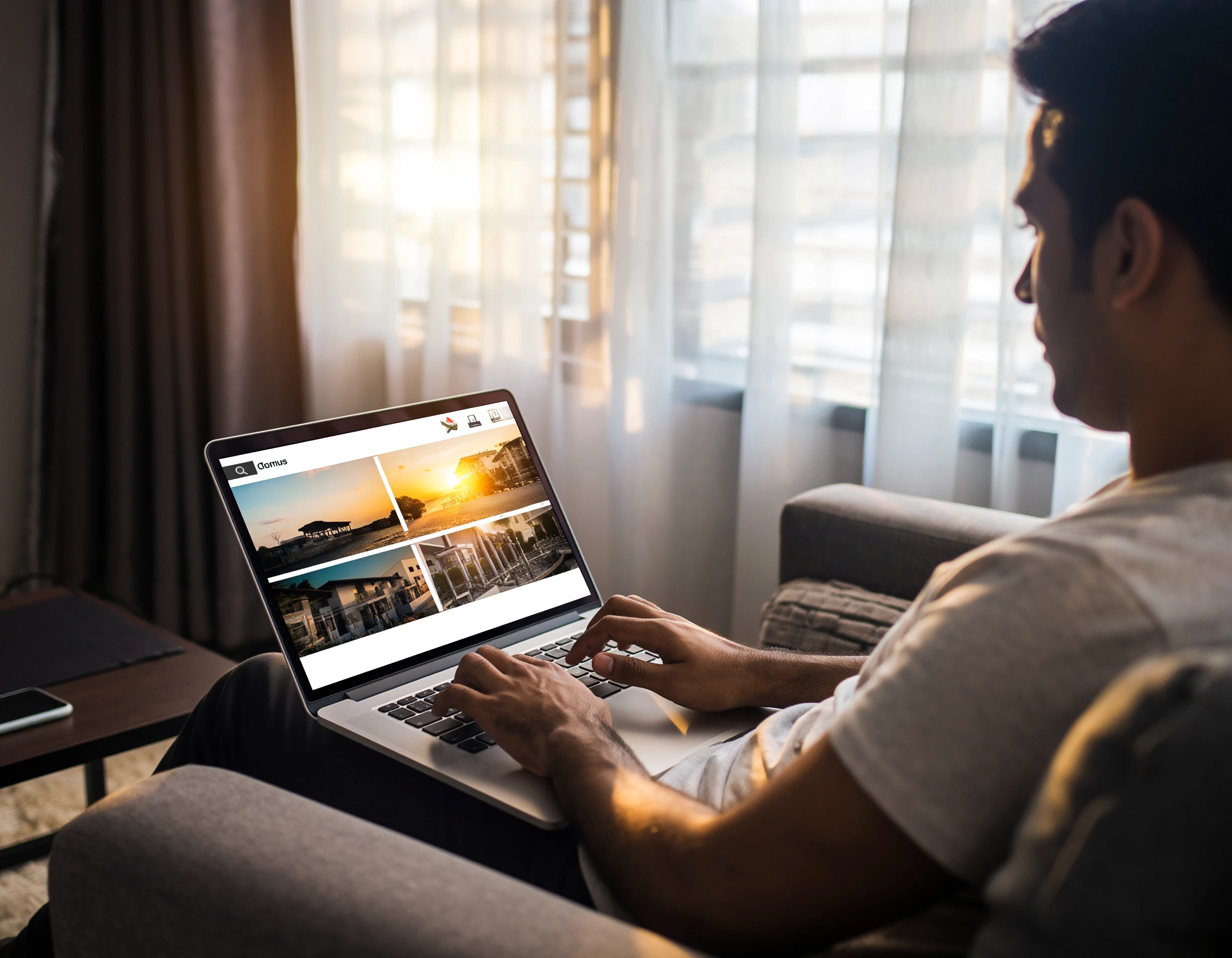 A person comfortably browsing a virtual property tour on a laptop at home.